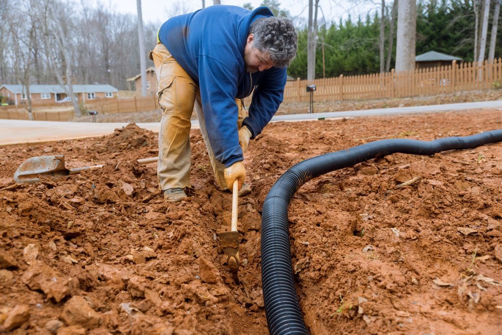 It is important to dig a trench to lay drainage pipes during heavy downpours in order to drain